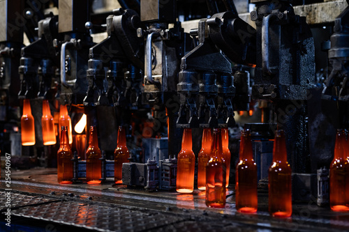  Hot glass bottles on glass production line