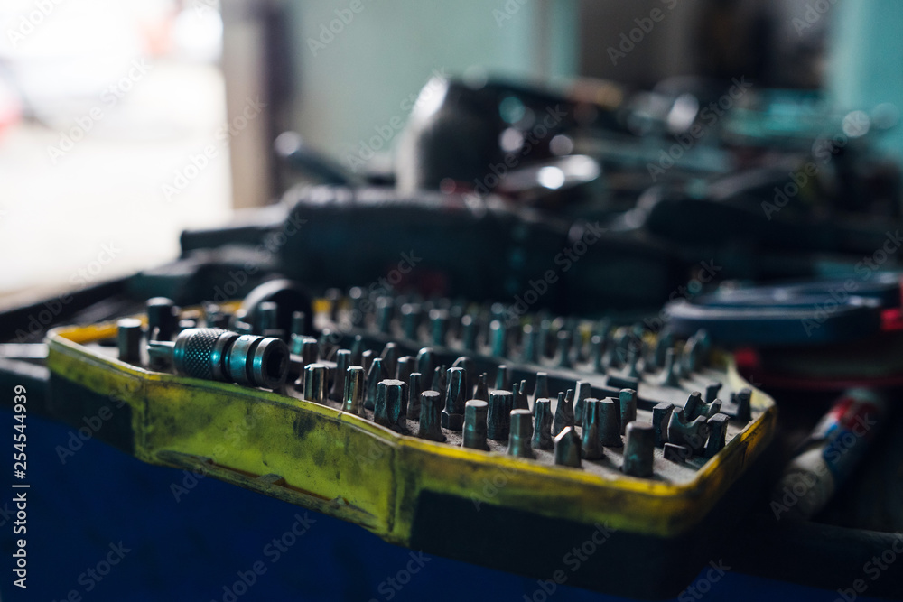 Electric screwdriver bits set tool in the garage workshop mechanic Electric screwdriver bits set tool in the garage workshop mechanic