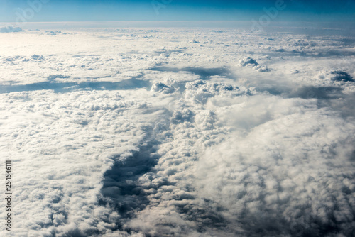 Top view of white clouds above the ground or water © Алексей Еремеев