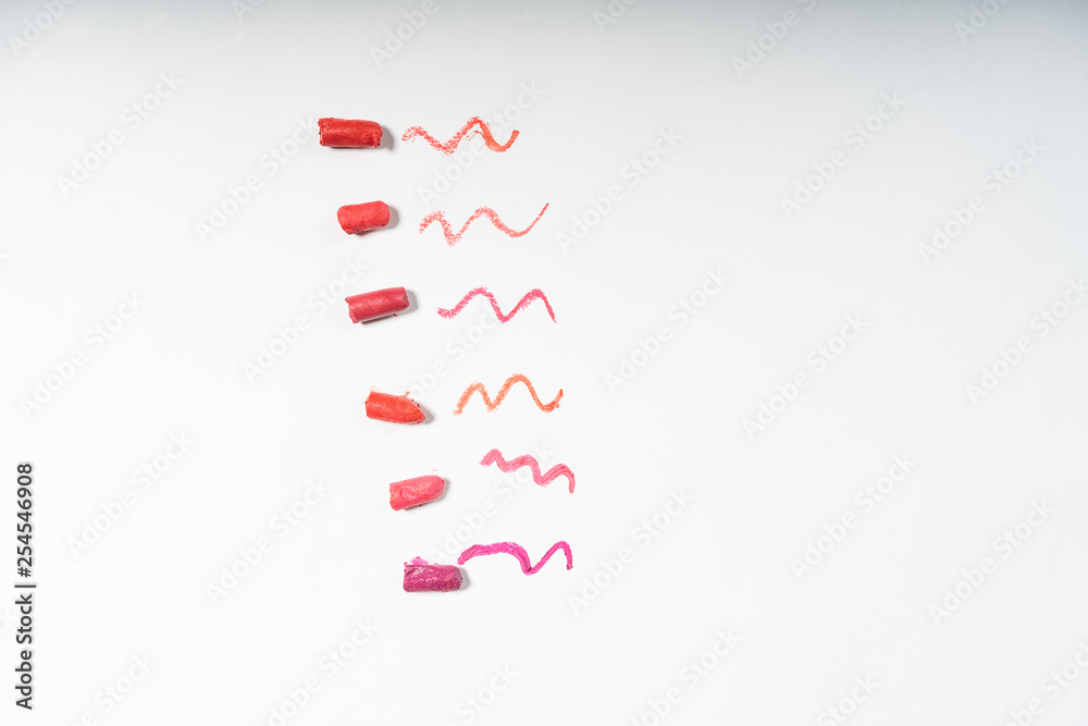 pieces of lipstick on white background pieces of lipstick on white background