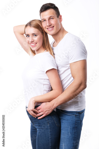 Romantic couple embracing each other on white