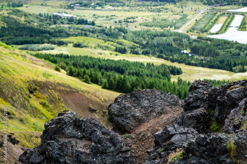 Rock formations in front of beautiful view from mountain Rock formations in front of beautiful view from mountain