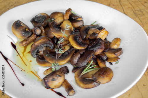 Field mushrooms baked with butter. With thyme and rosemary.