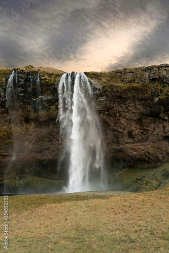 The magnificent waterfall Seljalandsfoss on a cloudy day