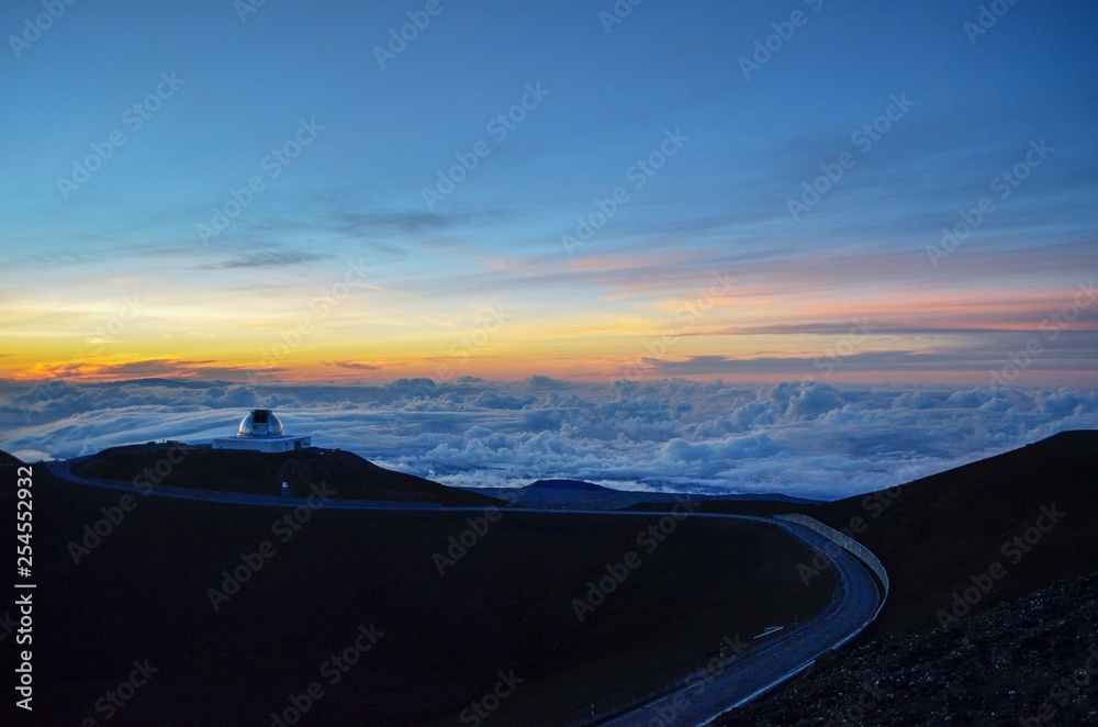 Access road for Telescopes on top of Volcano in Hawaii, with sunset
