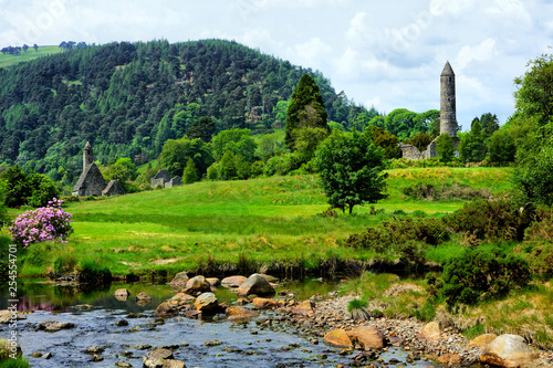 Fototapeta Naklejka Na Ścianę i Meble -  View of the historic Glendalough monastic site with ancient round tower and church in Wicklow National Park, Ireland