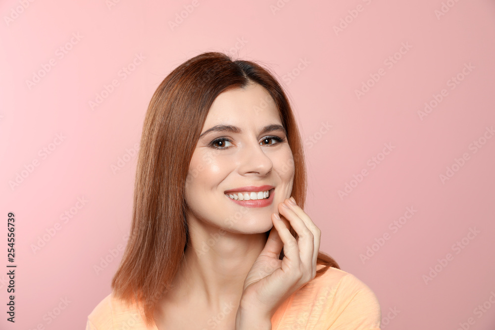 Smiling woman with perfect teeth on color background Smiling woman with perfect teeth on color background