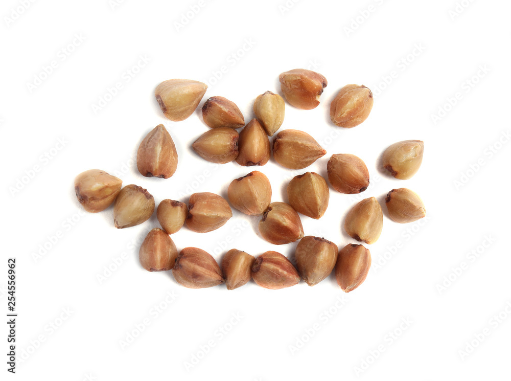 Uncooked buckwheat on white background, top view