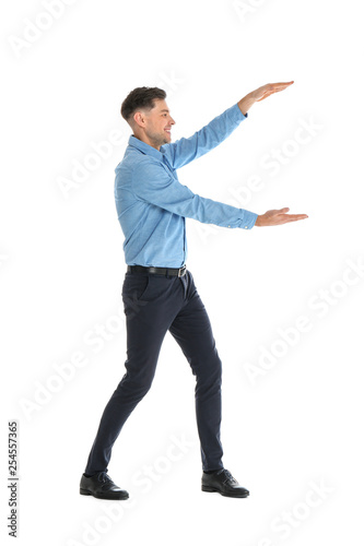 Man in office wear holding something on white background
