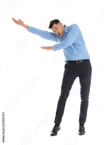 Emotional man in office wear posing on white background