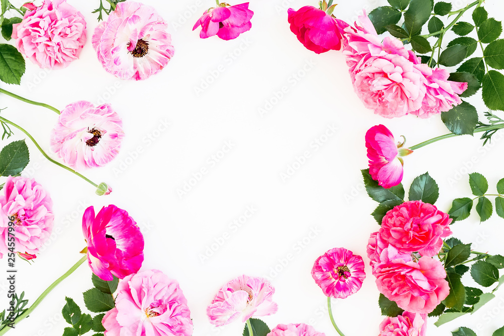 Frame with pink roses, petals and peonies on white background. Flat lay, Top view. Flowers texture.