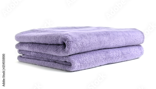 Folded clean soft towels on white background