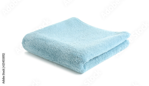 Folded soft terry towel on white background