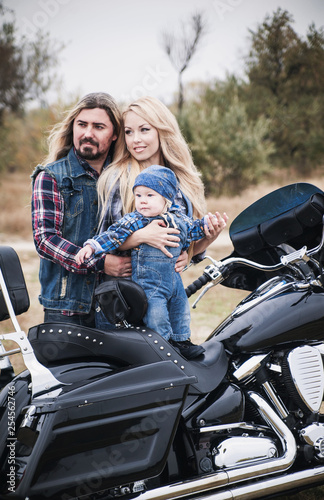Happy bikers family has a fun outdoor. Father's Day concept. Mother's Day concept. Family look.