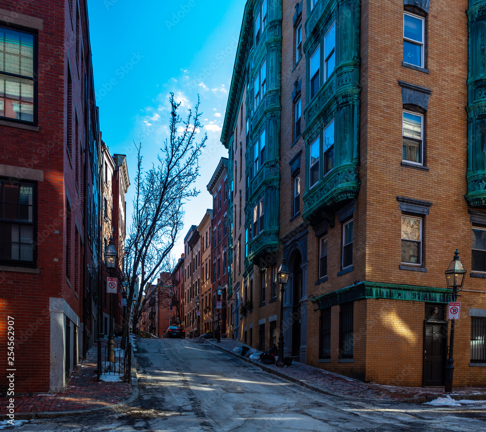 Boston, USA- March 01, 2019: picturesque Boston Streets with brick tiles and buildings. Boston is Capital city of state Massachusetts, United states of America