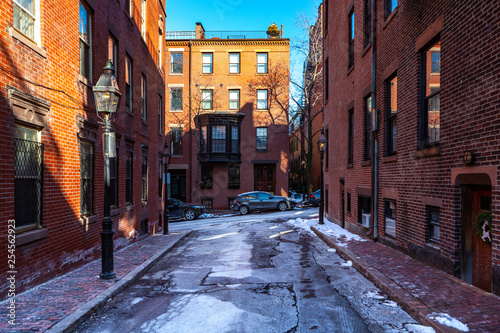 Boston, USA- March 01, 2019: picturesque Boston Streets with brick tiles and buildings. Boston is Capital city of state Massachusetts, United states of America
