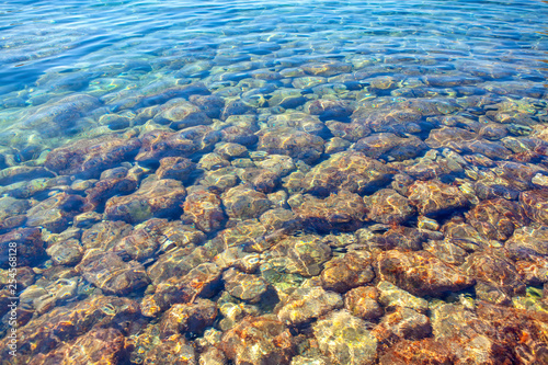 stones under transparent sea water