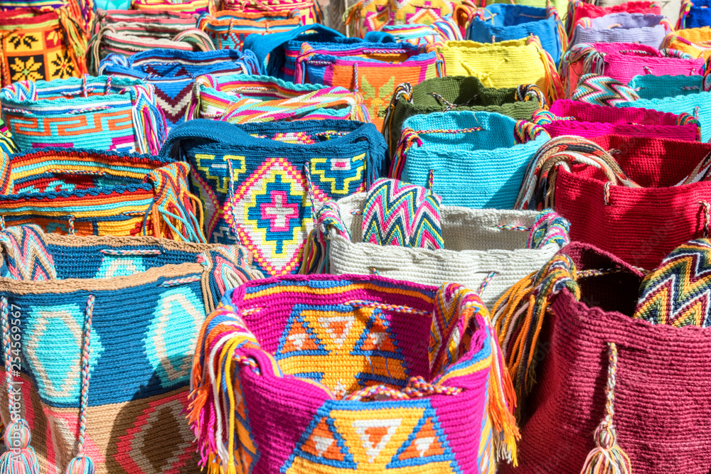 Mochilas guayu, colorful knit bags for sale in Bogota, Colombia at a street  market Stock Photo | Adobe Stock