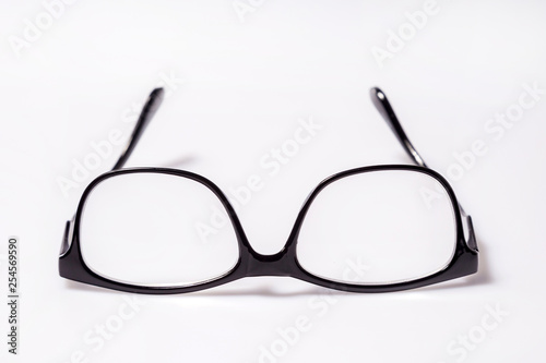 Black eye glasses spectacles with shiny black frame For reading daily life To a person with visual impairment isolaged on white background. photo