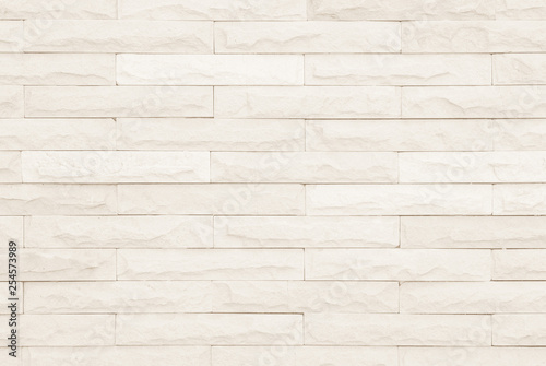 Cream and white brick wall texture background.