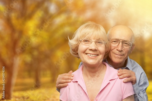 Wallpaper Mural Close-up portrait of an elderly couple hugging in park Torontodigital.ca