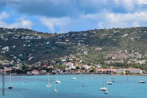 Mountain landscapes in background, yachts and sailboats on the ocean in Saint Thomas, US Virgin Islands