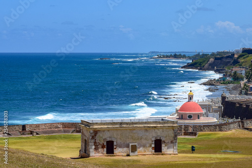 Coastline view in Old San Juan overlooking Santa Maria Magdalena de Pazzis Cemetery, which is next to Fort San Felipe del Morro. photo