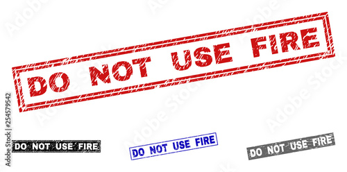 Grunge DO NOT USE FIRE rectangle stamp seals isolated on a white background. Rectangular seals with grunge texture in red, blue, black and grey colors.