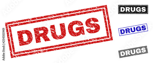 Grunge DRUGS rectangle stamp seals isolated on a white background. Rectangular seals with grunge texture in red, blue, black and gray colors.