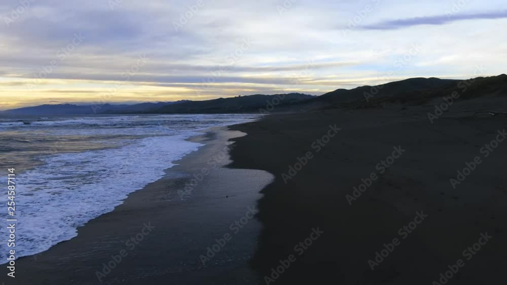 Sunset leaking through cloud cover at beach. Vibrant and beautiful Sunset leaking through cloud cover at beach. Vibrant and beautiful