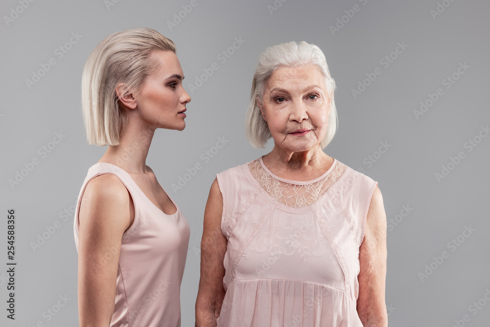 Old grey-haired woman with bob hairstyle looking directly into camera Old grey-haired woman with bob hairstyle looking directly into camera