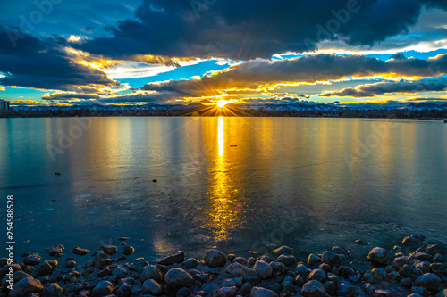 Colorful and Beautiful Sunset Over Sloan's Lake in Denver, Colorado photo