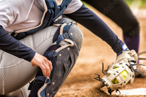 close up of softball catcher in dirt photo