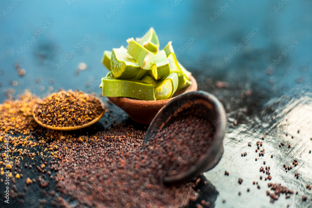 Best hair remedy to reduce hair fall and effective exfoliation of skin on wooden surface . Mustard seeds oil well mixed with aloe vera gel and entire ingredients. Stock Photo | Adobe Best hair remedy to reduce hair fall and effective exfoliation of skin on wooden surface . Mustard seeds oil well mixed with aloe vera gel and entire ingredients. Stock Photo | Adobe