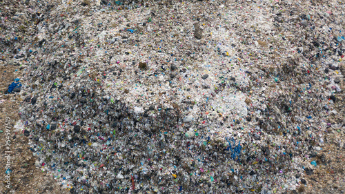 Garbage pile in trash dump or landfill, Aerial view garbage trucks unload garbage to a landfill, global warming.