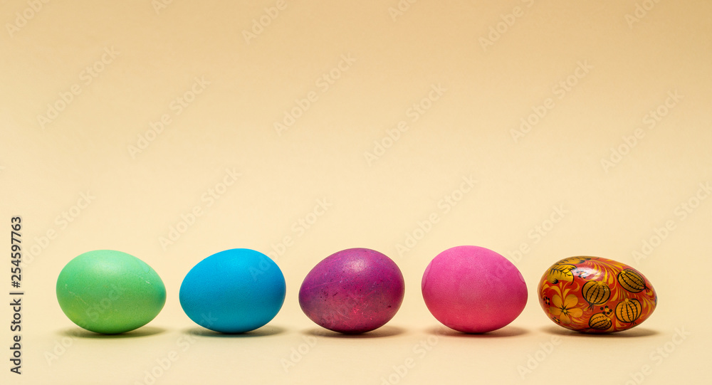 Colorful easter eggs isolated on beige background Colorful easter eggs isolated on beige background
