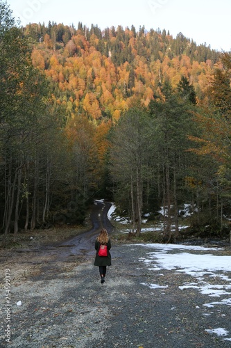 woman walking among beautiful autumn colors.artvin/turkey