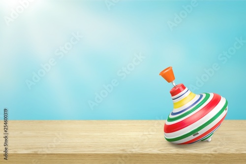 Schilderij op canvas Toy spin spinning top old spinning toy isolated top