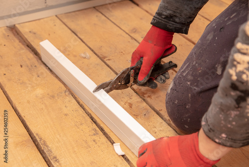 Wallpaper Mural Worker mounts a profile on a wall at a construction site Torontodigital.ca