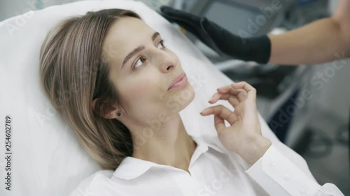 Wallpaper Mural Close up young woman shows beautician areas on her face for injection and treatment Torontodigital.ca