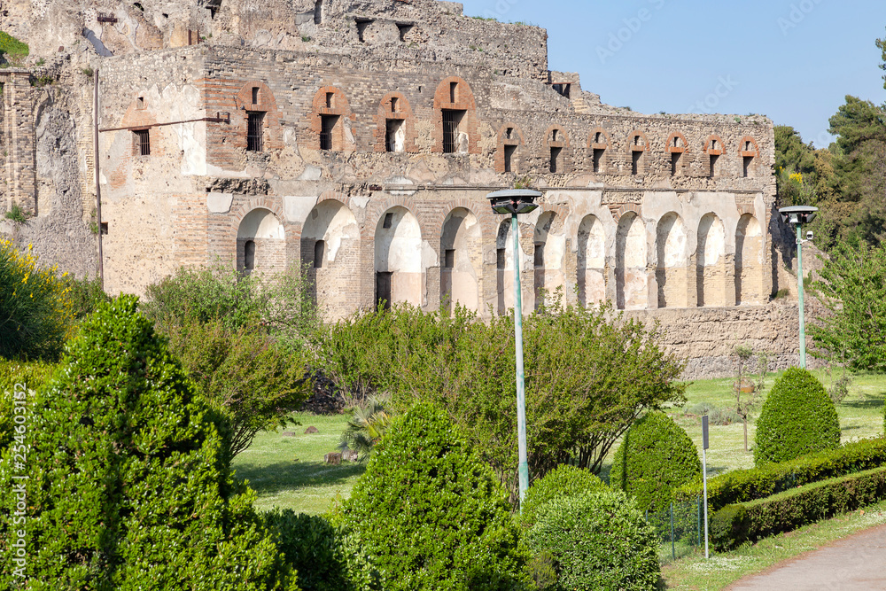 Fototapeta premium The city of Pompeii buried under a layer of ash by the volcano Mount Vesuvius