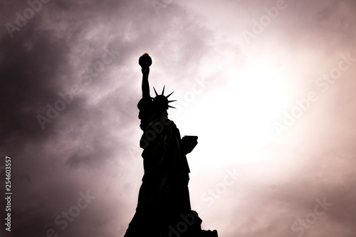 November 2018 - Backlight view of American symbol Statue of Liberty silhouette in New York  USA.