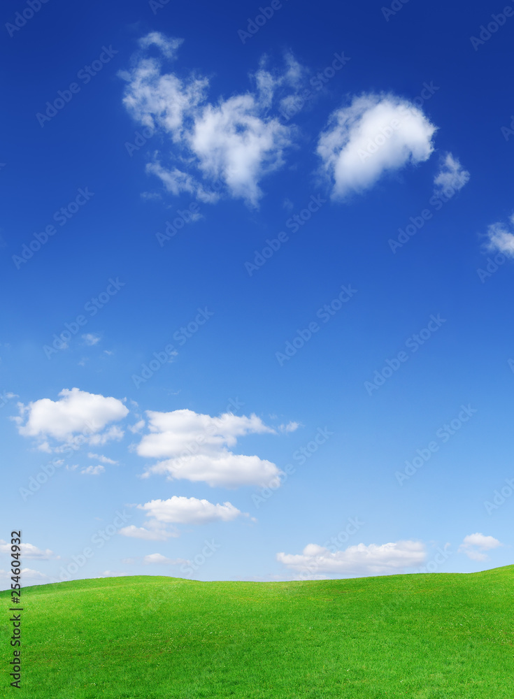 Idyllic view, green hills and blue sky with white clouds Idyllic view, green hills and blue sky with white clouds