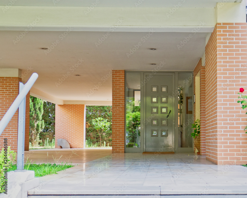 Obraz premium elegant contemporary apartment building entrance, Athens Greece