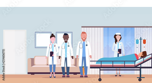 mix race doctors team visiting patient man lying bed intensive therapy ward healthcare concept hospital room interior modern medical clinic horizontal