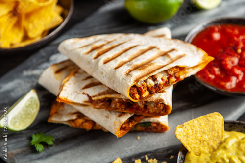 Chicken quesadillas with paprika, cheese and cilantro photo