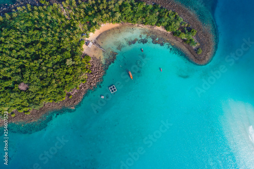 Amazing island with sand beach green tree forest aerial view
