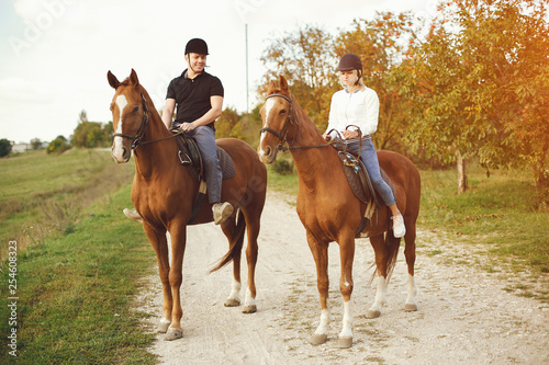 couple with horses © hetmanstock2