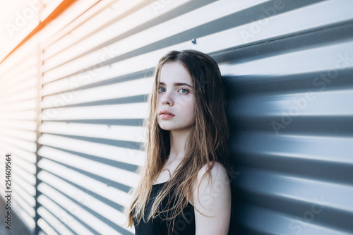 Free Download Cute cheerful portrait of young teenage girl outdoors in the street . Emotions, portrait, beauty concept - GFXLoad