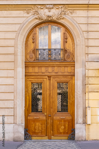 Paris, beautiful wooden massive door, girder with sculptures 